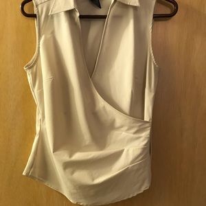 Sleeveless white stretch wrap around blouse
